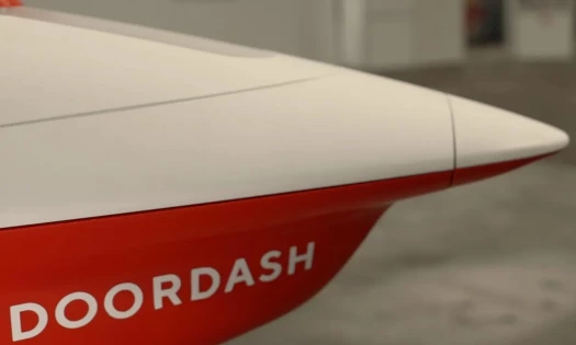 Up-close shot of DoorDash drone in the brand's red and white colors.