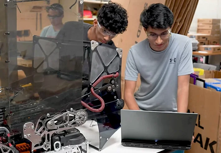 a student is editing video on ASUS ROG laptop