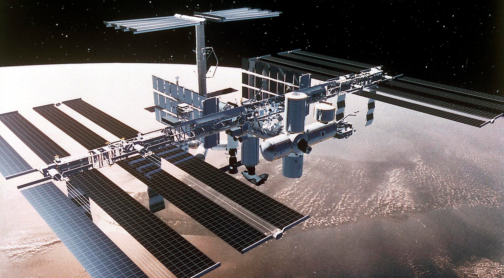 NASA astronaut in space station with HP workstations