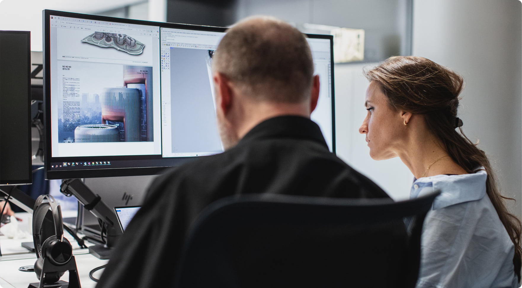 Male and female architects using HP workstations and HP Poly headsets