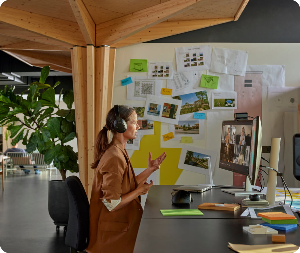 Woman at desk in office on video call