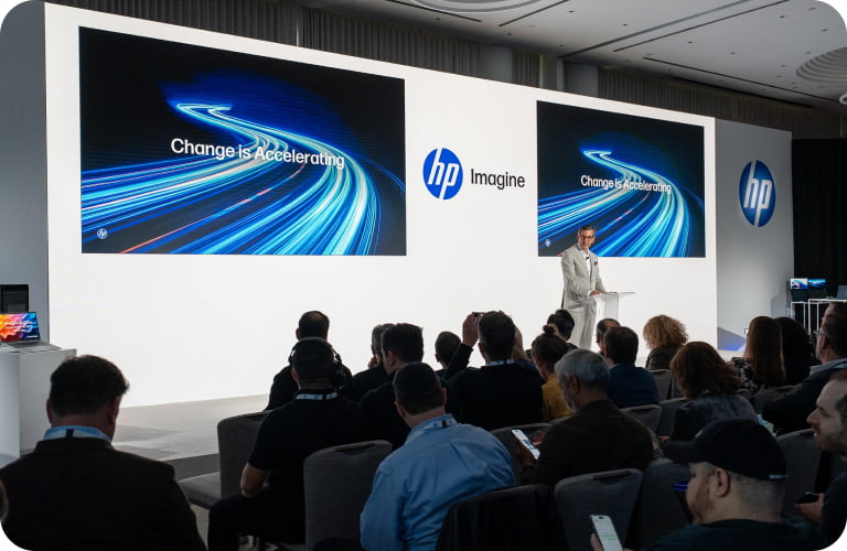 Bruce Broussard presenting on stage at HP Imagine.