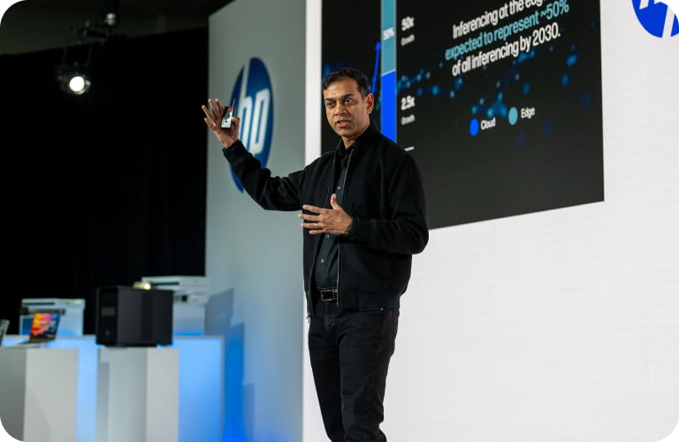 Prakash Arunkundrum presenting on stage at HP Imagine.