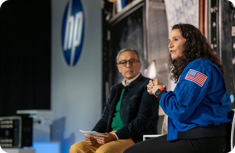 Antonio Lucio and Serena Auñón‑Chancellor on stage at HP Imagine.