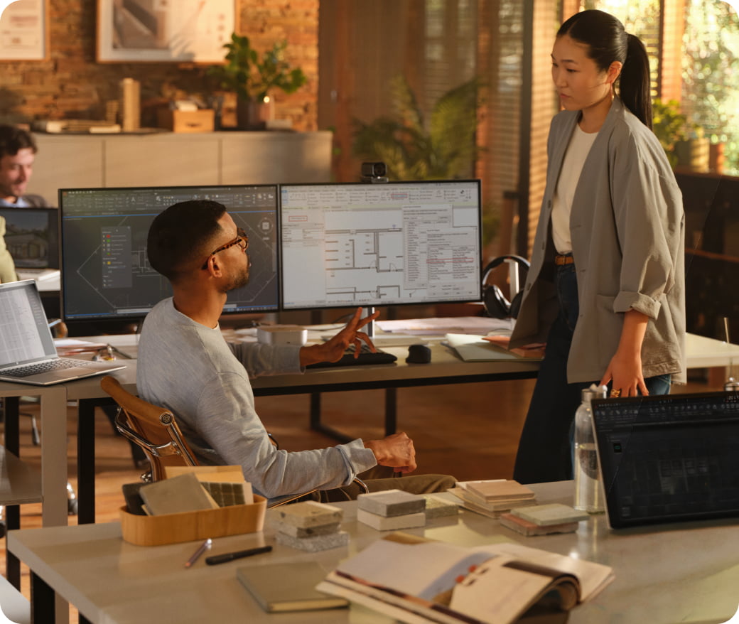 Male and female professional collaborating in a modern workspace with a HP ZBook 8 G1ah 14 inch Mobile Workstation PC